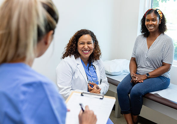 fellowship trained orthopedic surgeon helping patient