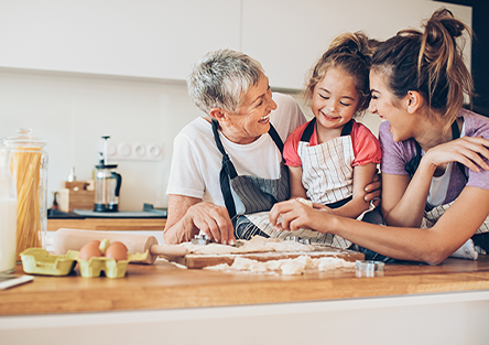 Three generations of woman cooking