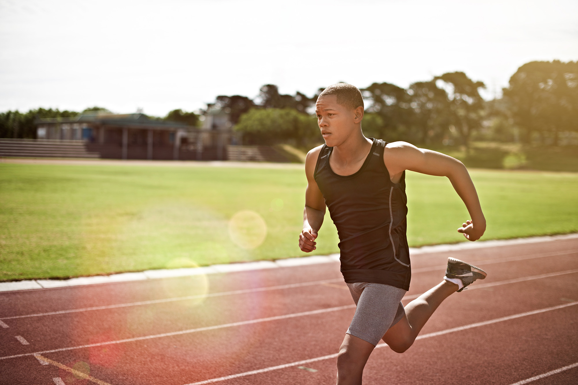 Young athlete out running on the track