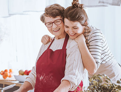 mom and daughter cooking in the kitchen