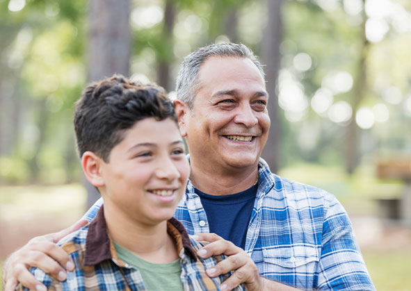 A father and son smiling